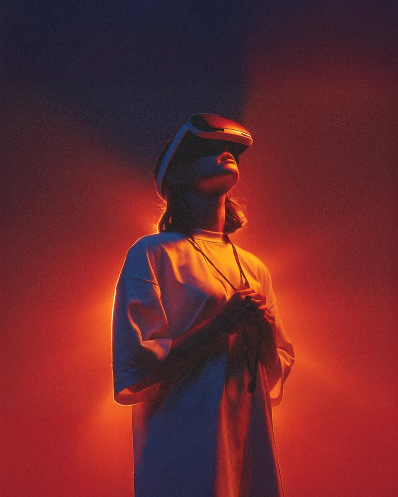 Futuristic scene with a person in a VR headset, bathed in pi…